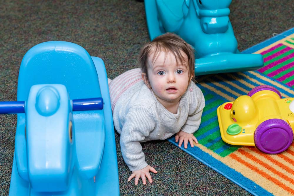 Toddler crawling at the Pittsford location